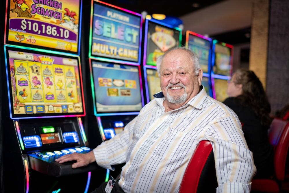 Man sitting at gaming machine