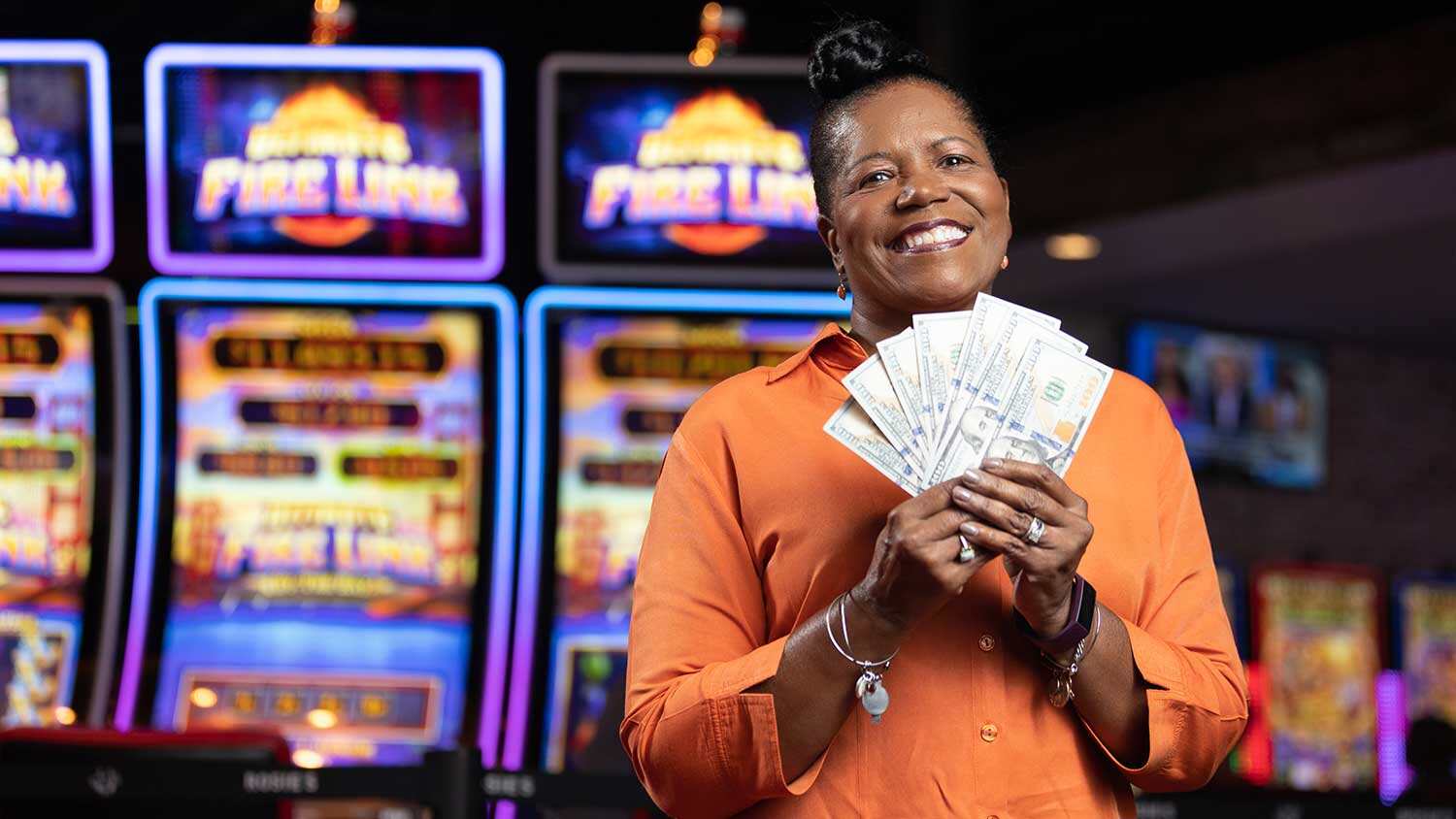 Woman holding money on gaming floor